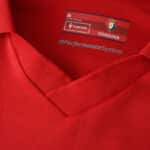 Close-up of the Osasuna 2025/26 Home Fan Version jersey collar showing club label and Macron branding.