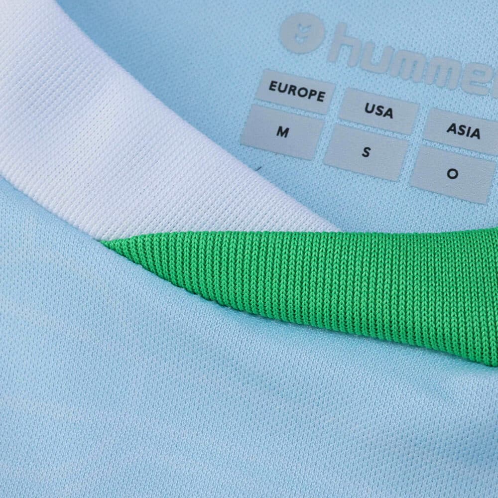 Close-up of the Real Betis Away 2025/26 Fan Version jersey collar and size tags.