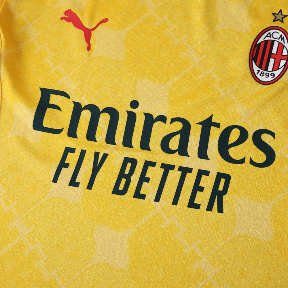 Close-up of AC Milan Third 2025/26 Player Version jersey, yellow with club badge and sponsor logos.