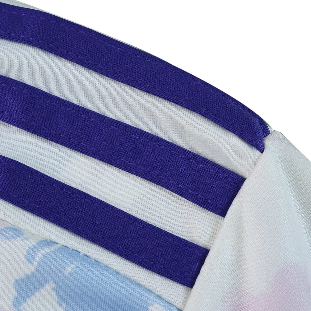 Close-up of Aston Villa Third 2025/26 Fan Version jersey shoulder with purple stripes and light pattern.