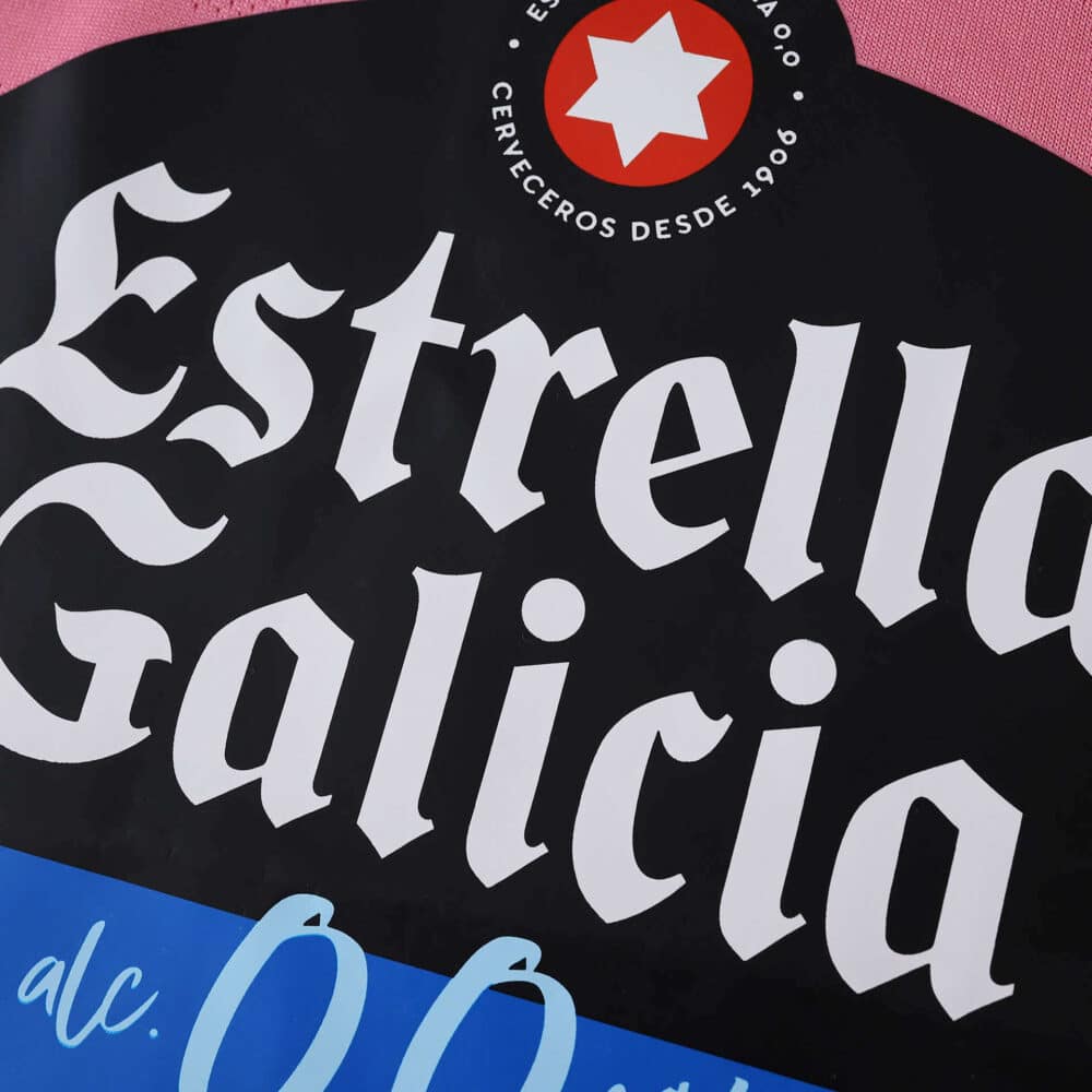 Close-up of the Estrella Galicia logo featured on the Celta Vigo Third 2025/26 Fan Version jersey.