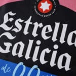 Close-up of the Estrella Galicia logo featured on the Celta Vigo Third 2025/26 Fan Version jersey.