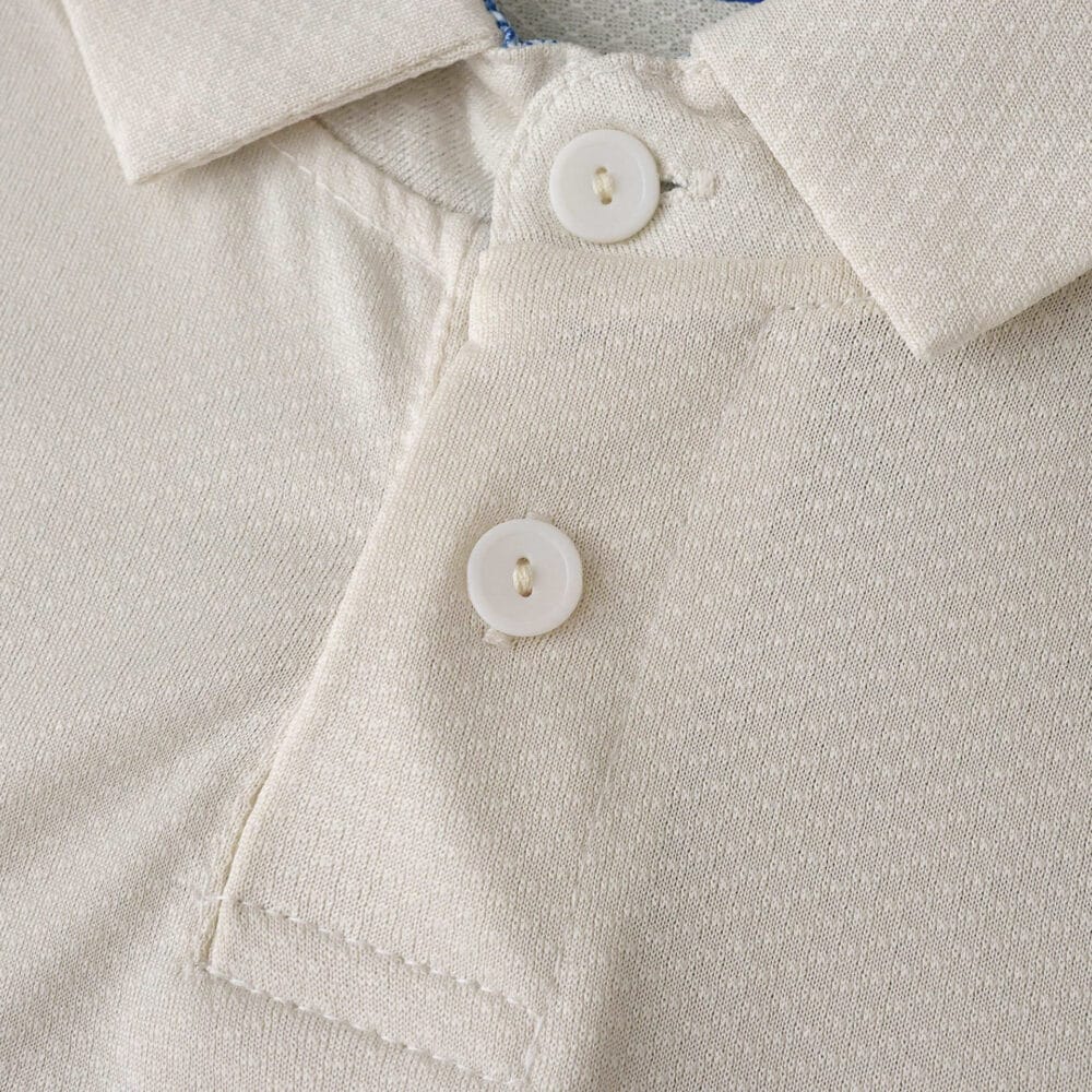 Close-up of FC Porto Third 2025/26 Fan Version jersey collar and button details in beige fabric.