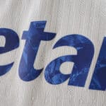Close-up of FC Porto Third 2025/26 Player Version jersey showing textured fabric and blue printed text.