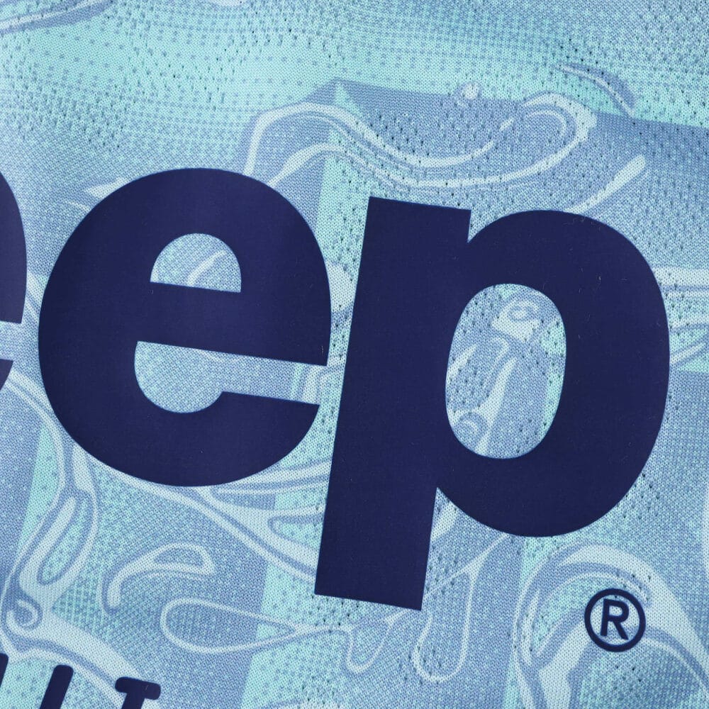 Close-up of Juventus Away 2025/26 Player Version jersey showing sponsor logo and fabric texture.