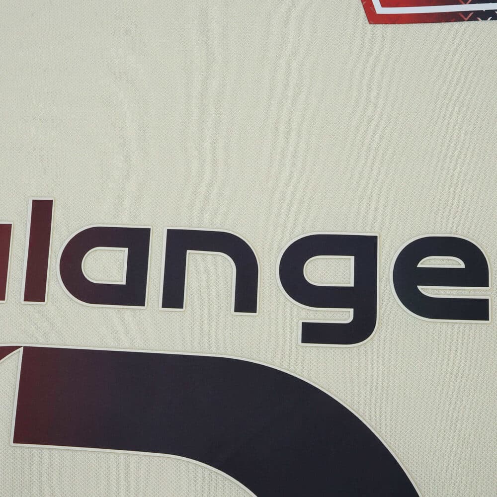 Close-up of Lille LOSC Away 2025/26 Fan Version jersey showing part of the printed sponsor logo.