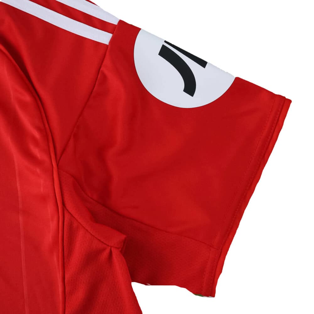 Detail of the Sevilla FC Away 2025/26 Fan Version jersey sleeve with red fabric and white accent.